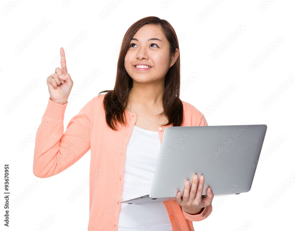 Asian woman use of the laptop computer and finger point up Asian woman use of the laptop computer and finger point up