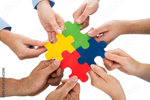 People Hands Connecting Jigsaw Pieces photo