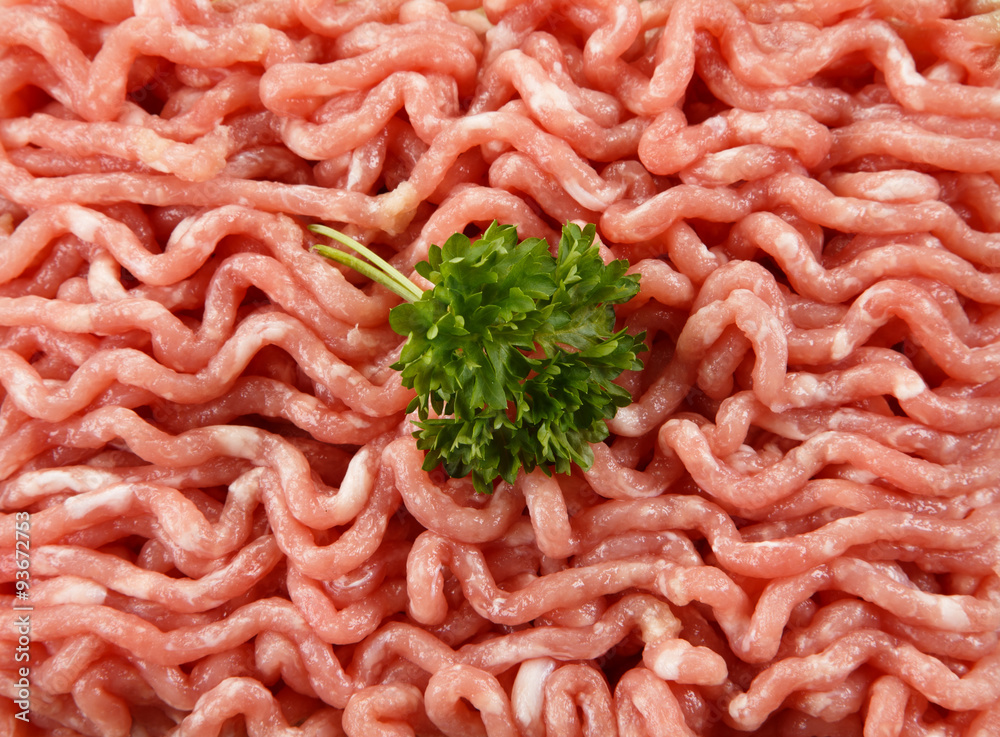 Raw minced pork on cutting board and vegetables Raw minced pork on cutting board and vegetables