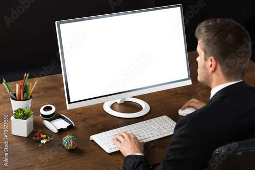 Businessman Working On Desktop Computer