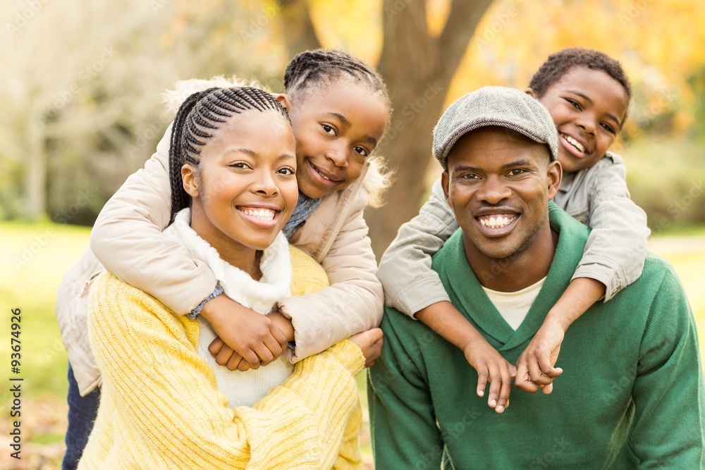 Portrait of a young smiling family in piggyback Portrait of a young smiling family in piggyback