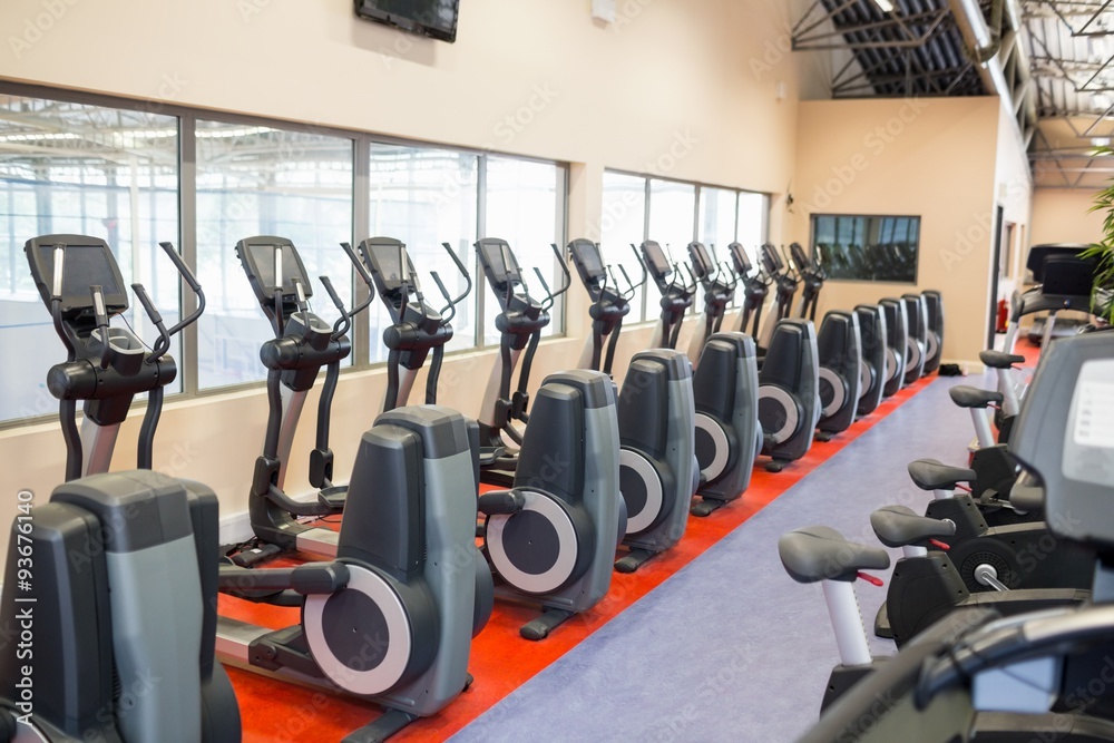 Fototapeta premium Collection of exercise bikes in a row