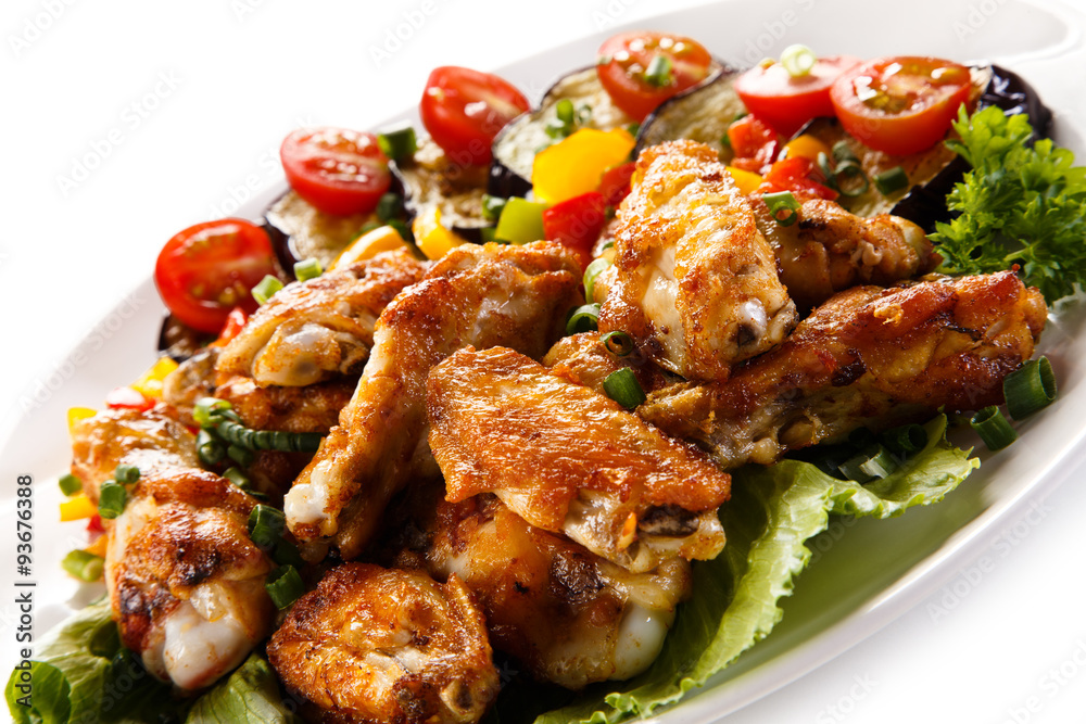 Grilled chicken wings and vegetables
