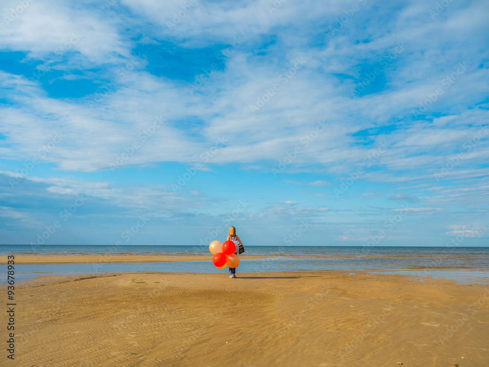 beautiful woman holding balloons