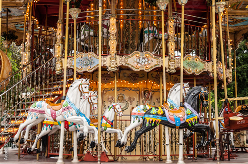 Ancient carousel de Paris with horses