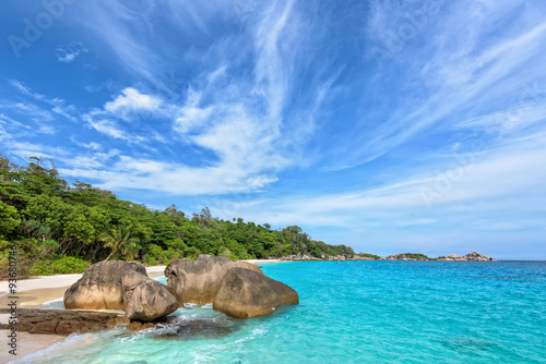 Beautiful landscape of blue sky sea sand and white waves on beach near the rocks during summer at Koh Miang island in Mu Ko Similan National Park  Phang Nga province  Thailand