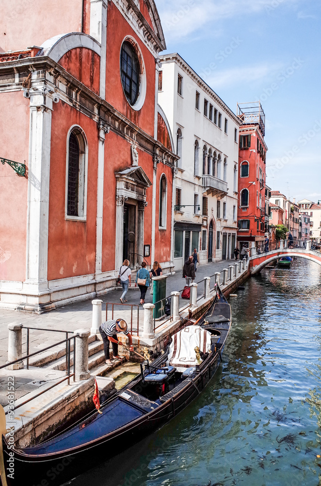 Tourists on water street with Gondola in Venice
