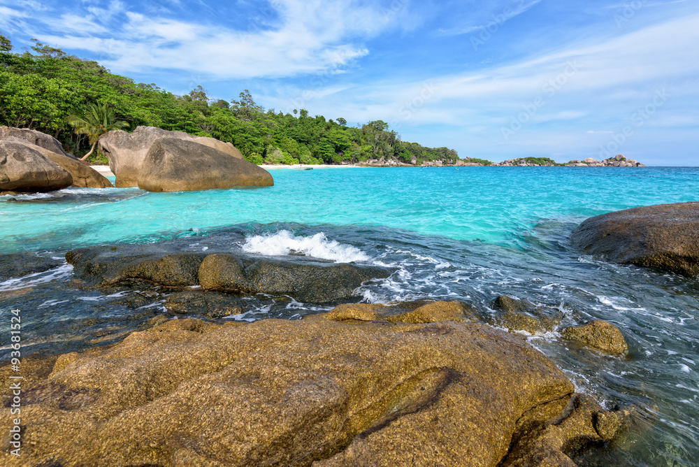 Beautiful landscape of blue sky sea and white waves on beach near the rocks during summer at Koh Miang island in Mu Ko Similan National Park, Phang Nga province, Thailand