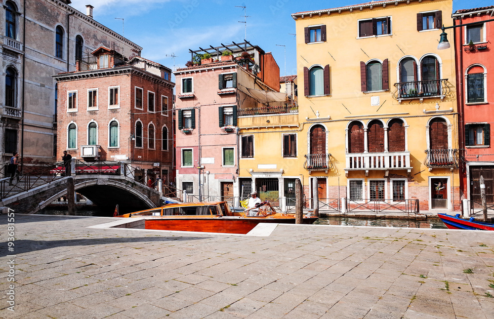 Tourists on water street with Gondola in Venice