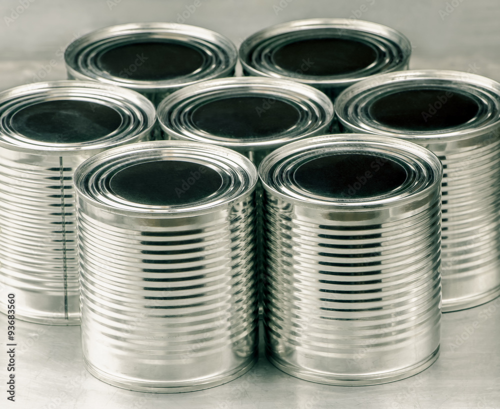 Tin cans for food on aluminum background, Selective focus and color effect Tin cans for food on aluminum background, Selective focus and color effect