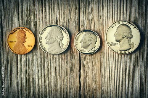 Fototapeta Naklejka Na Ścianę i Meble -  US cent coins over wooden background