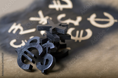 International black currency units on dappled background