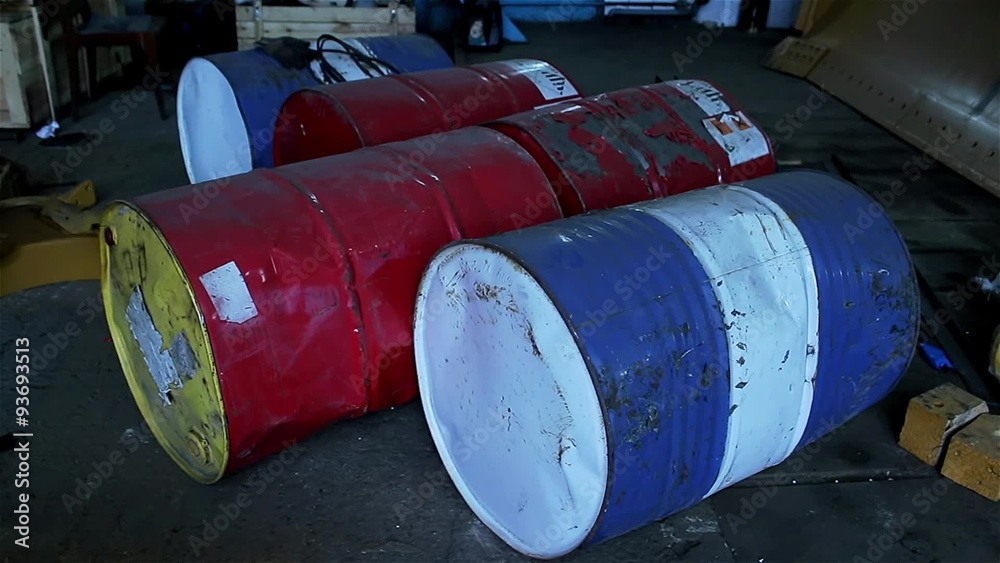 old barrels with gasoline lie on the floor old barrels with gasoline lie on the floor