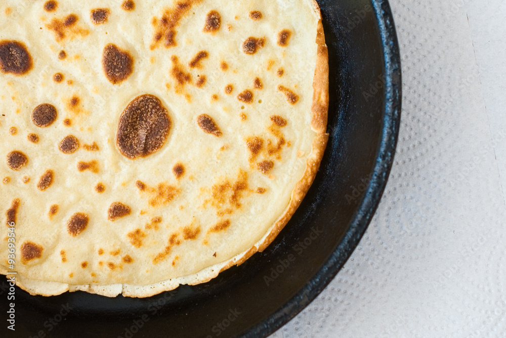 round pancake on white background - from above - studio shot round pancake on white background - from above - studio shot