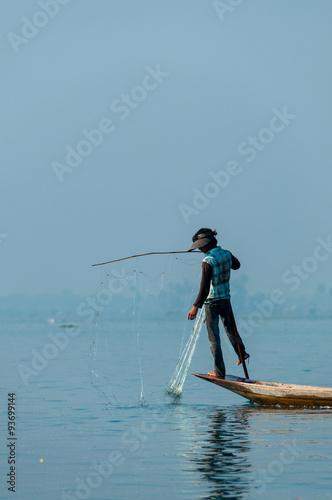 Fisherman at Inle Lake working on one foot