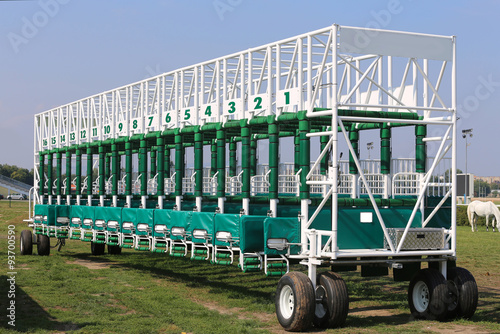 Green colored start gates for horse races on the racetrack