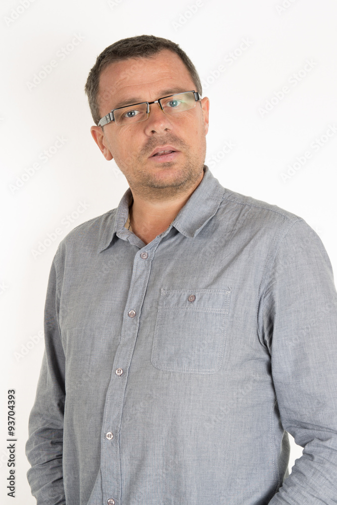 Handsome man with glasses, unhaven with a blue casual shirt Handsome man with glasses, unhaven with a blue casual shirt