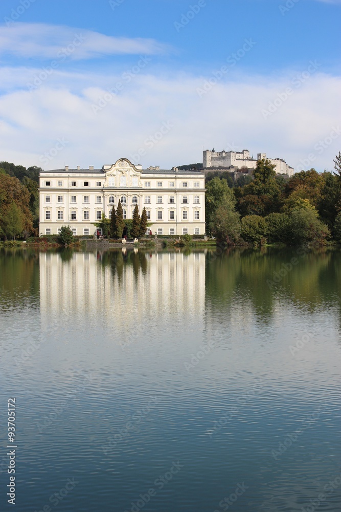 Leopoldskron Palace in Salzburg, Austria, Europe, with fortress Hohensalzburg in the background. The Palace was film location for the Musical Sound of Music with Julie Andrews.