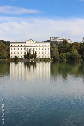 Leopoldskron Palace in Salzburg, Austria, Europe, with fortress Hohensalzburg in the background. The Palace was film location for the Musical Sound of Music with Julie Andrews. photo
