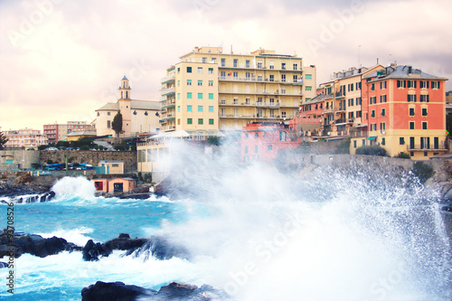Genova Quinto with rough seas.  View of the city of Genova Quinto (Italy) with wave in foreground. © EurekA_89 Gervasio S