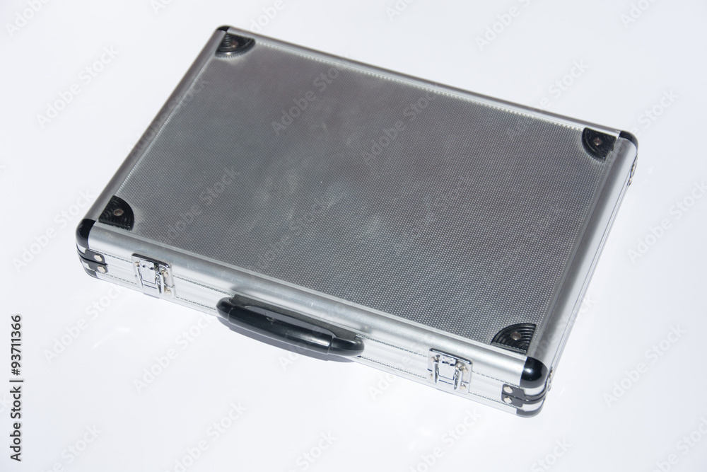 Old aluminium case on the white background Old aluminium case on the white background