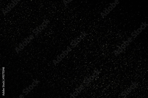 Abstract dark glitter lights background. 