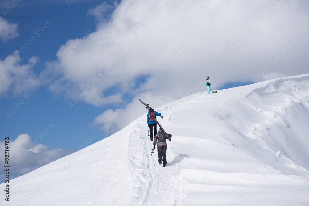 Skiers walking uphill for freeride