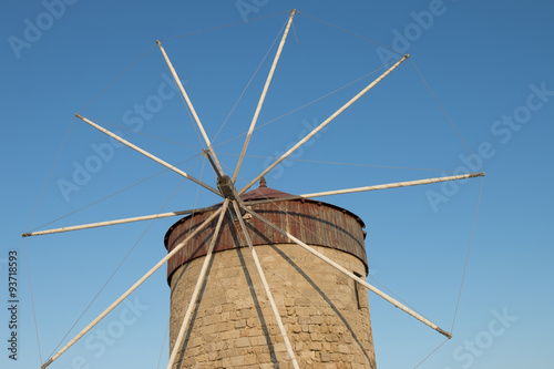Old windmill against the blue sky.