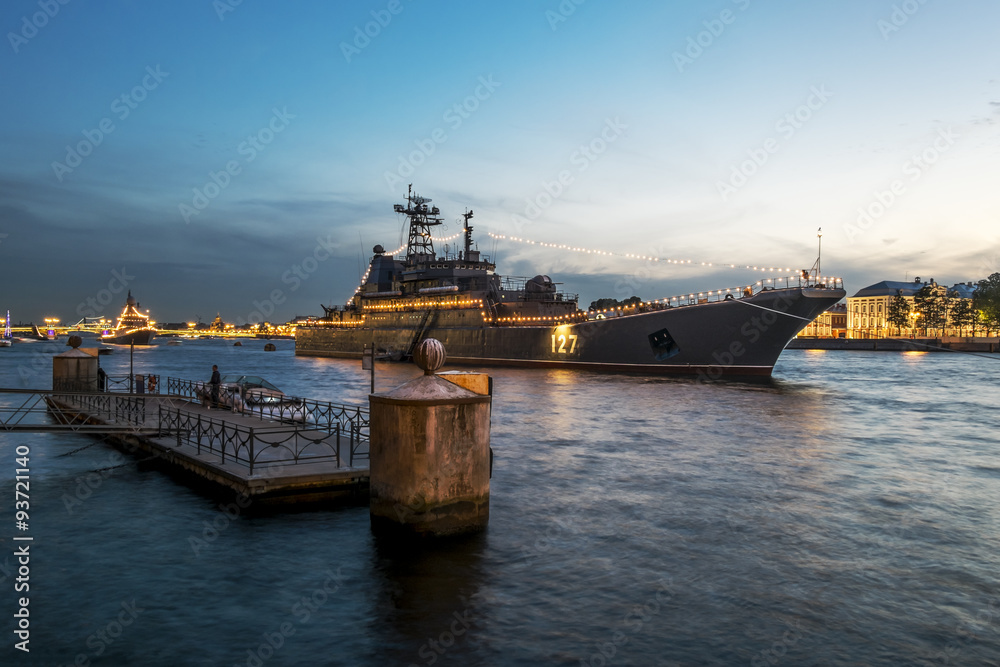 Warships in the waters of the Neva River in St. Petersburg at ev Warships in the waters of the Neva River in St. Petersburg at ev