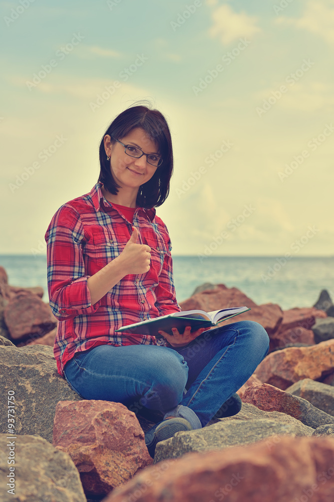 hipster girl showing thumb up hipster girl showing thumb up
