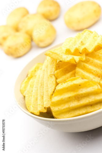 Potato chips on white background..