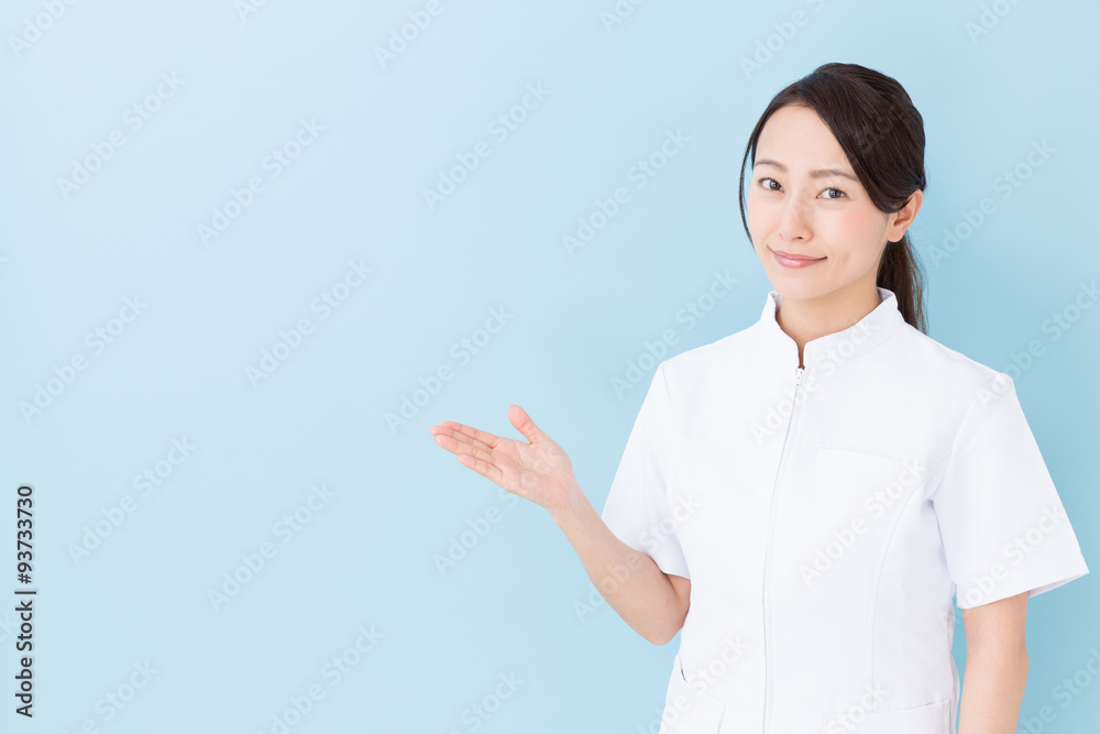 portrait of asian nurse on blue background portrait of asian nurse on blue background