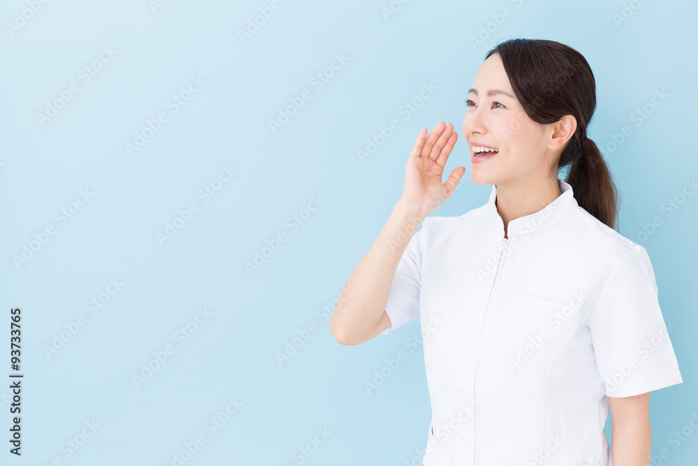 portrait of asian nurse on blue background portrait of asian nurse on blue background