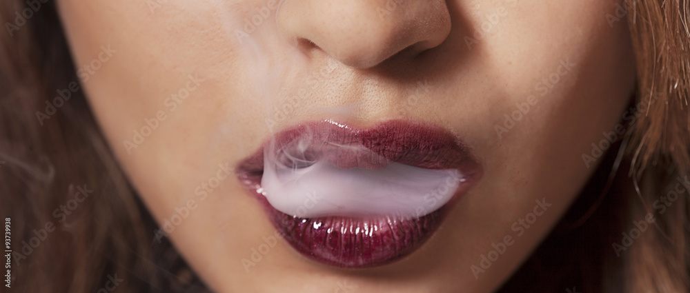 Fototapeta premium Sexy woman smoking closeup letterbox