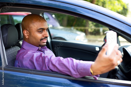driver taking a selfie in his car