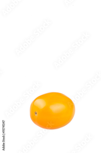 Yellow cherry tomato on white background
