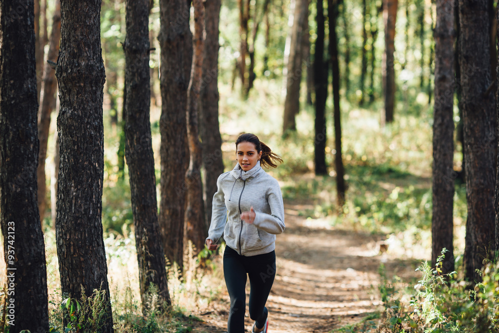  Runner woman jogging in autumn park