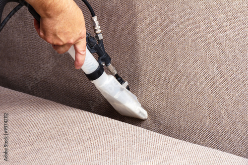Professional cleaning of the upholstery on a sofa
