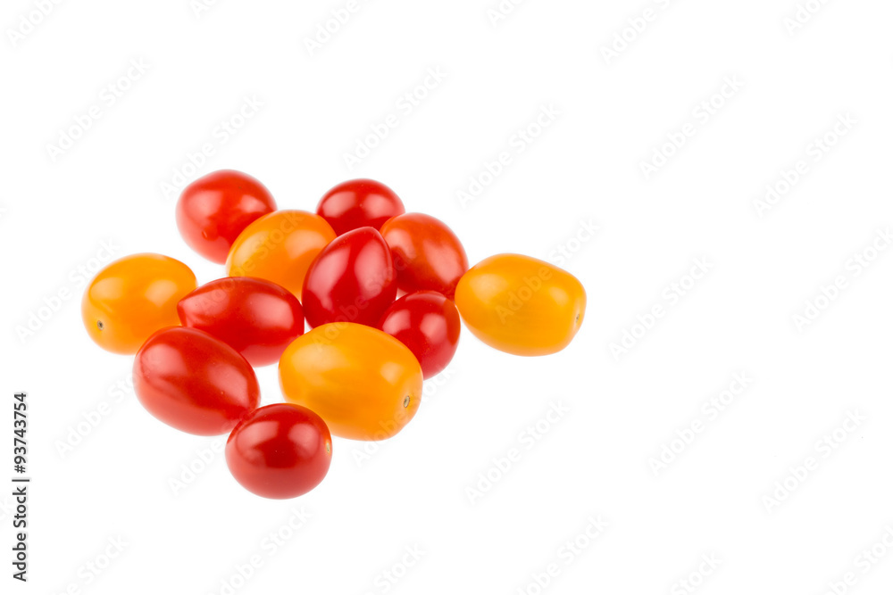 Yellow and red cherry tomatoes on white background Yellow and red cherry tomatoes on white background