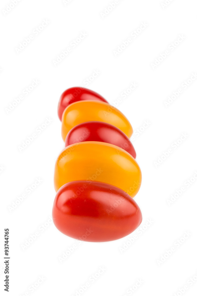 Yellow and red cherry tomatoes on white background Yellow and red cherry tomatoes on white background