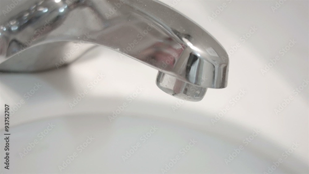 Bathroom sink tap dripping water HD 003 Bathroom sink tap dripping water HD 003