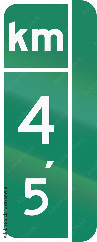 Guide and information road sign in Quebec, Canada - Milestone sign with distance in kilometers, version for the right side of the road Guide and information road sign in Quebec, Canada - Milestone sign with distance in kilometers, version for the right side of the road