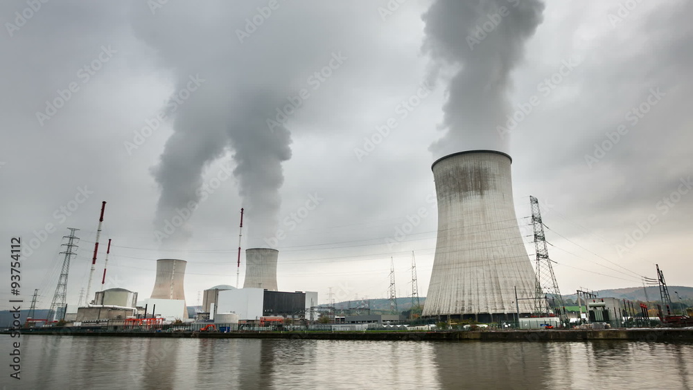 Time lapse sequence of a large nuclear power plant at a river on an overcast day Time lapse sequence of a large nuclear power plant at a river on an overcast day