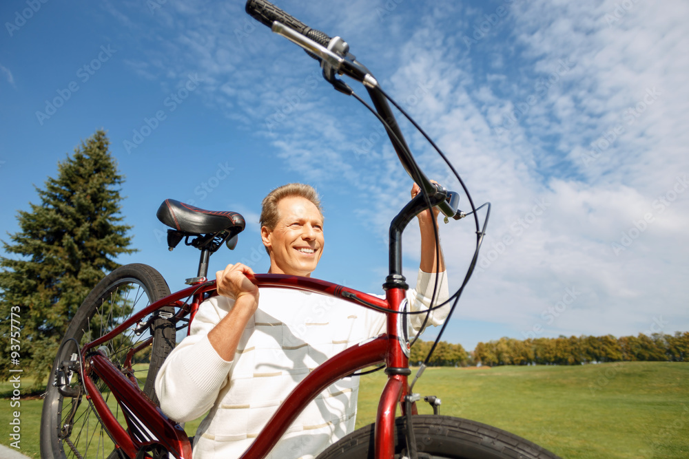 Obraz premium Adult man riding a bicycle