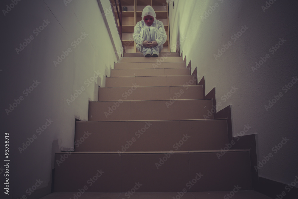 Fear, mental disorders, man with red mask and white paper suit