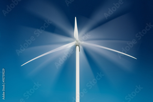 Wind Turbine turning over blue sky © nexusseven