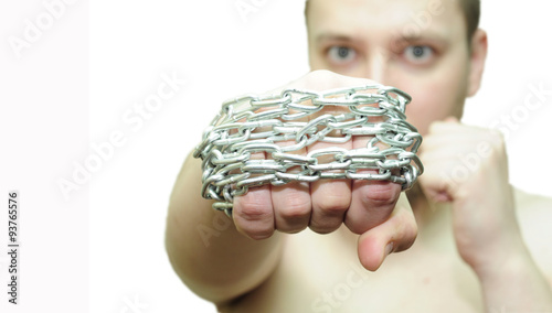 man hit brass knuckles with chains