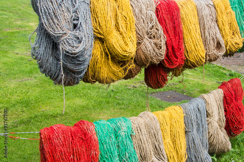 Colored carpet yarn drying at the Tapestry Museum in Genemuiden photo