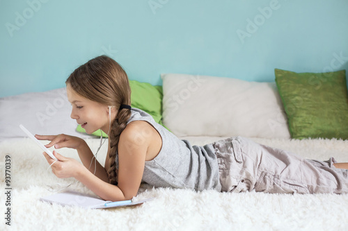 Pre teen girl relaxing at home