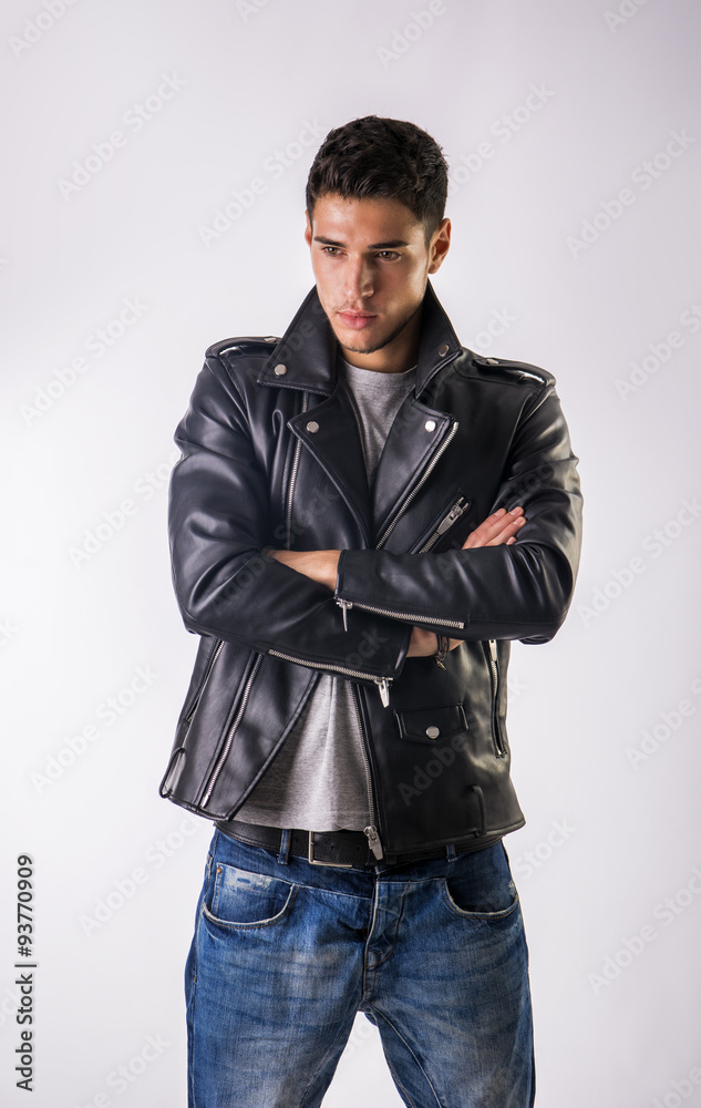 Handsome young man wearing leather jacket, t-shirt and jeans Stock Photo |  Adobe Stock